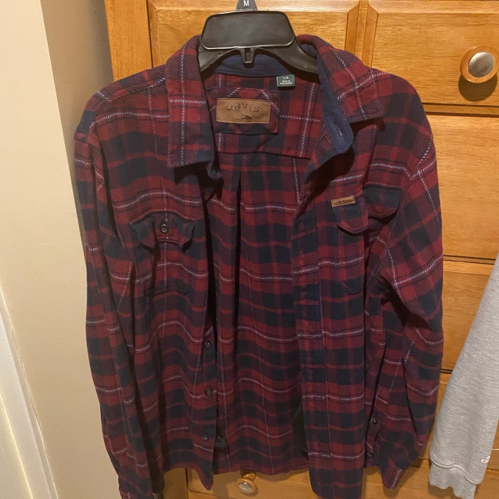 Orvis dark blue and red jacket.